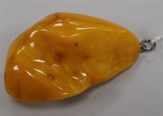 A large yellow amber pendant, 66mm